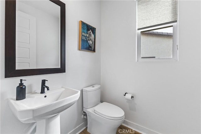 bathroom with sink and toilet