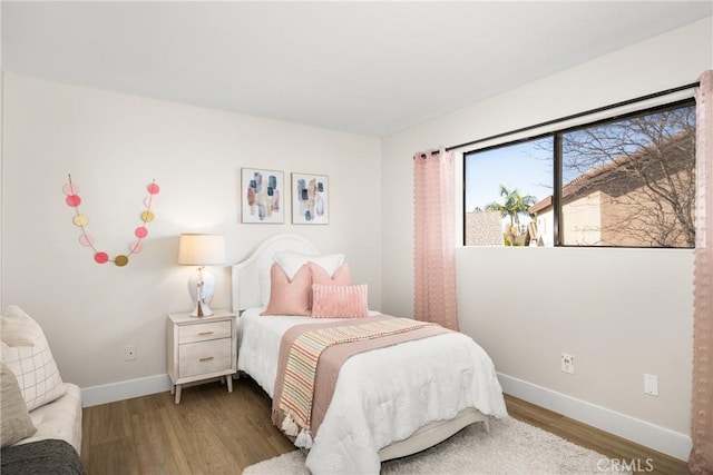 bedroom featuring hardwood / wood-style floors