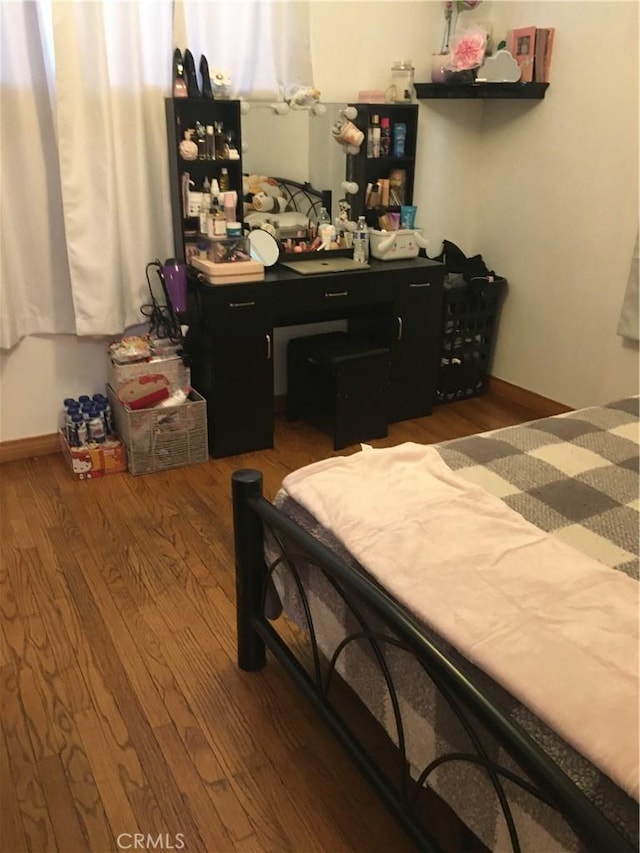 bedroom with wood-type flooring