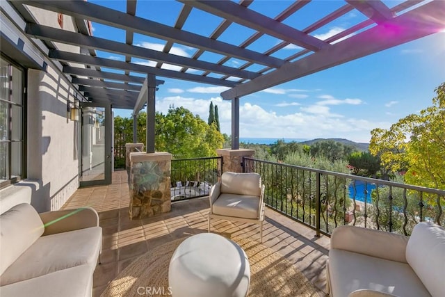 balcony featuring an outdoor hangout area and a pergola