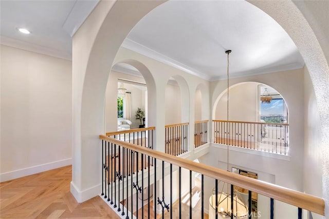 hall featuring crown molding and light parquet floors