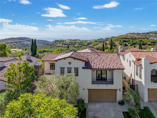 birds eye view of property with a mountain view