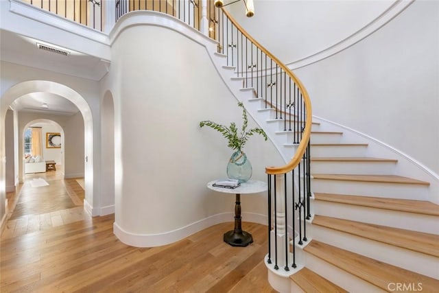 stairs with wood-type flooring