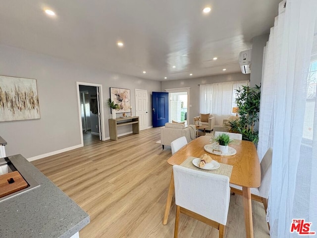 dining area with light wood-type flooring