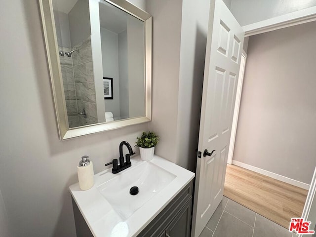 bathroom featuring tile patterned flooring and vanity