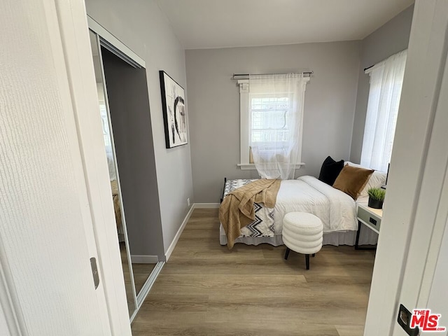 bedroom with light hardwood / wood-style flooring