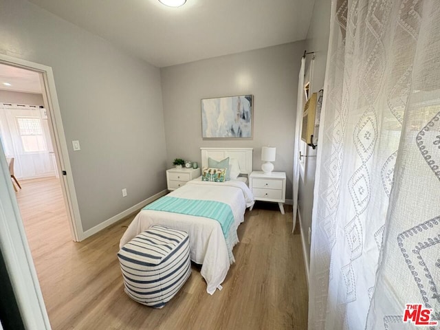 bedroom with light hardwood / wood-style floors