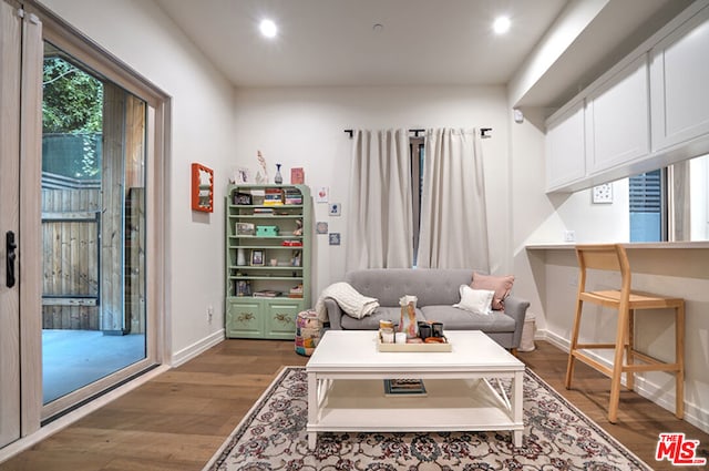 interior space with built in desk and dark hardwood / wood-style flooring