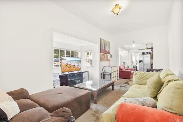 living room featuring ceiling fan and light colored carpet