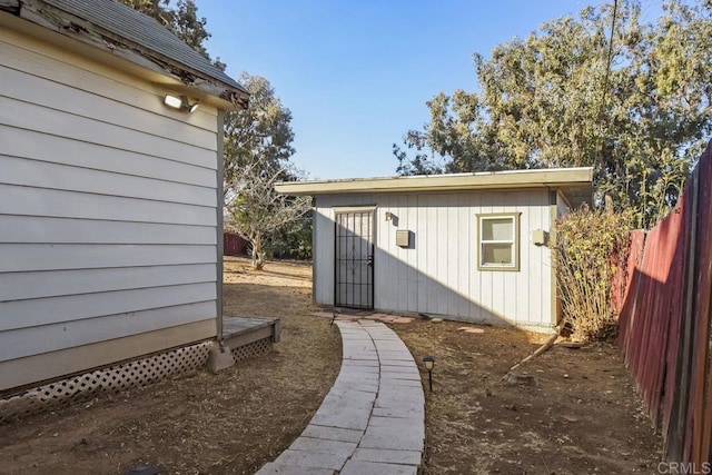 view of property exterior featuring an outdoor structure