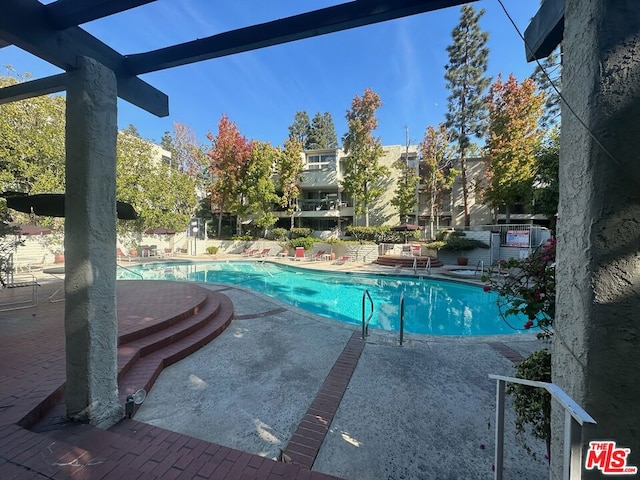 view of swimming pool featuring a patio