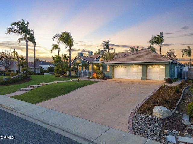 ranch-style home with a lawn