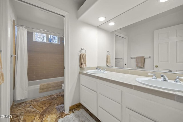 full bathroom with toilet, vanity, and shower / tub combo with curtain