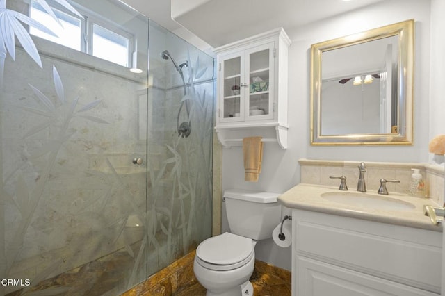 bathroom with vanity, toilet, and an enclosed shower