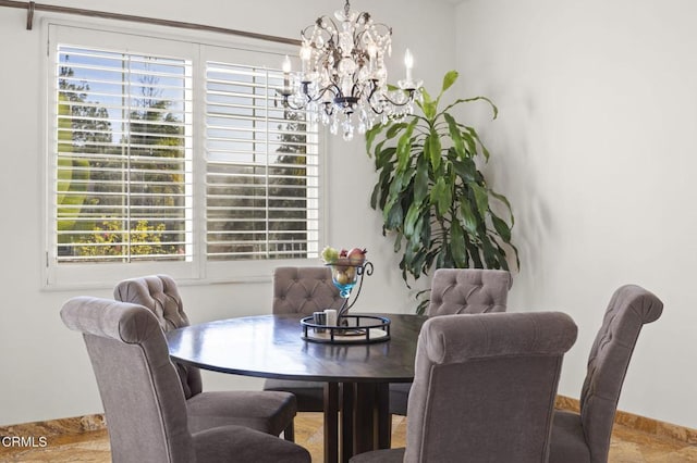 dining area with a chandelier and a wealth of natural light