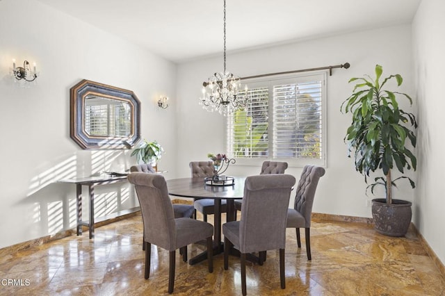 dining space featuring a chandelier