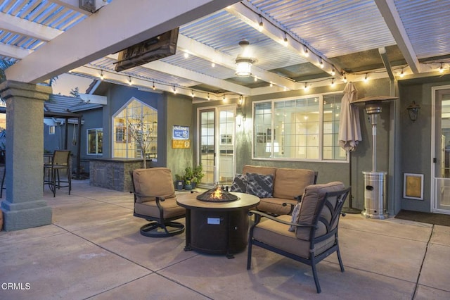 view of patio with a fire pit and a pergola