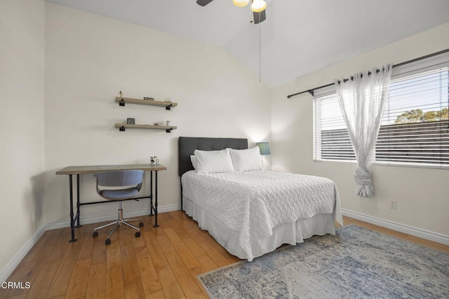 bedroom featuring lofted ceiling, hardwood / wood-style flooring, and ceiling fan