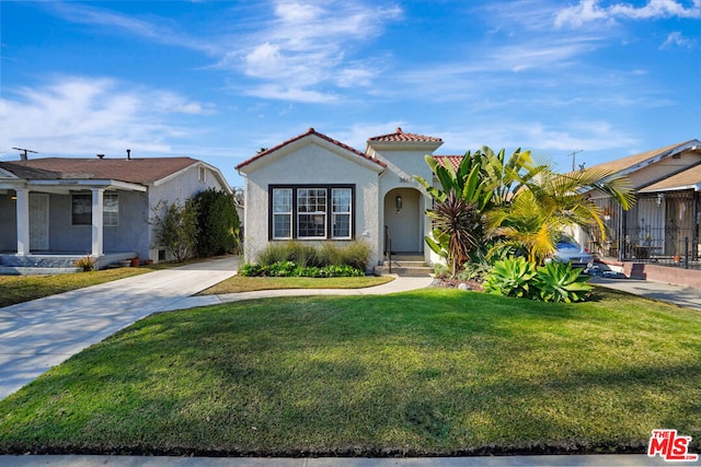 view of front of home with a front yard