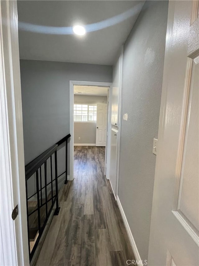 hall with dark hardwood / wood-style floors