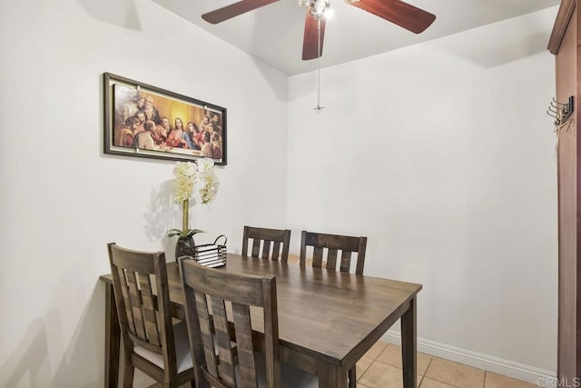 tiled dining room featuring ceiling fan