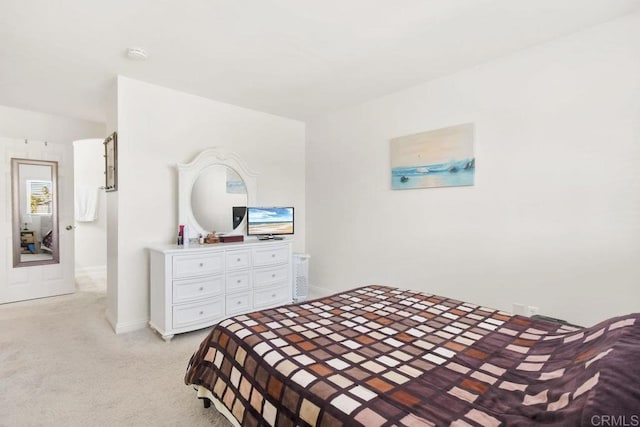 bedroom featuring light colored carpet