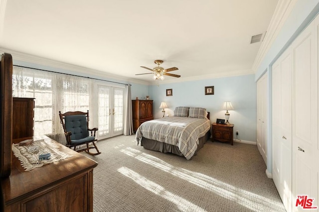 bedroom with ceiling fan, a closet, light colored carpet, french doors, and crown molding