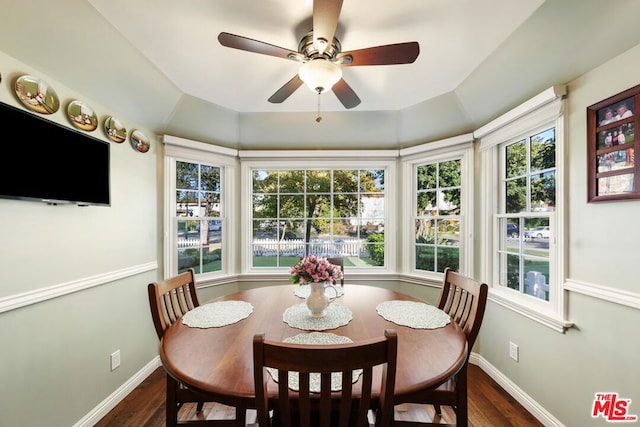 dining room with vaulted ceiling, dark wood-type flooring, and a wealth of natural light