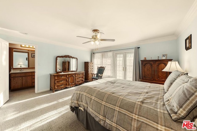 bedroom featuring carpet floors, connected bathroom, sink, ceiling fan, and crown molding