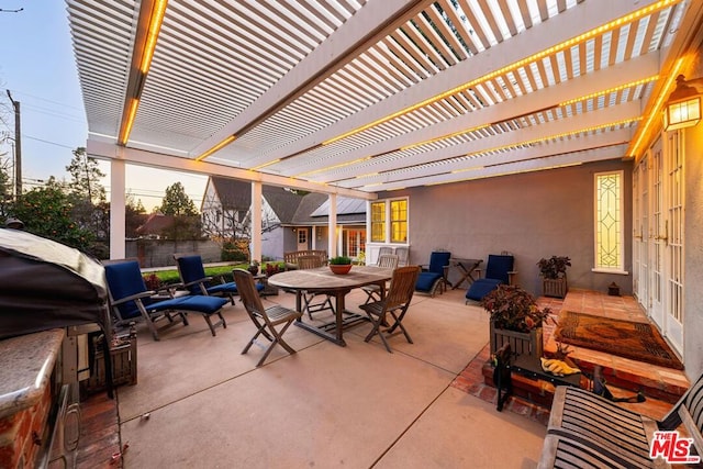 view of patio featuring area for grilling and a pergola