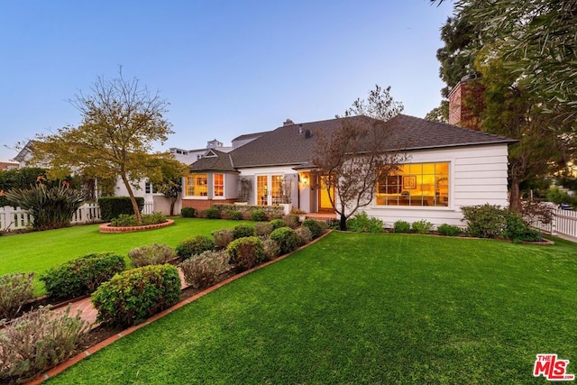 view of front of home with a front lawn