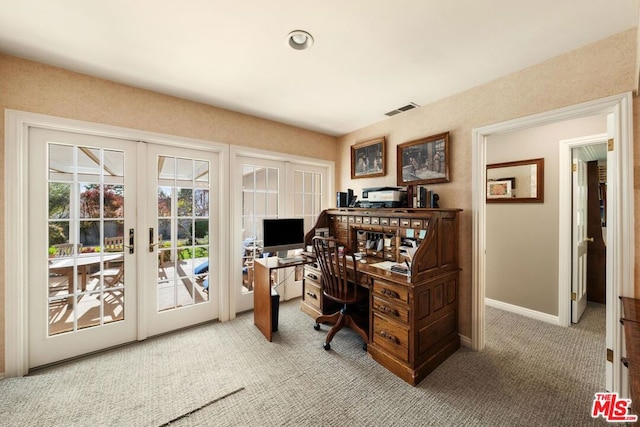 office space with light carpet and french doors