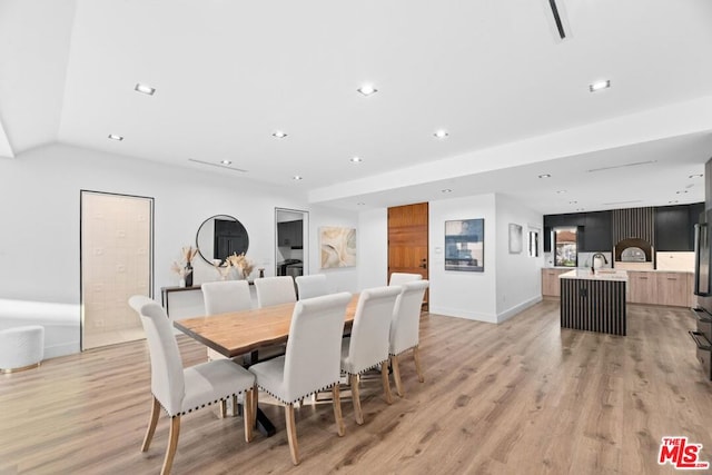 dining area featuring light wood-type flooring