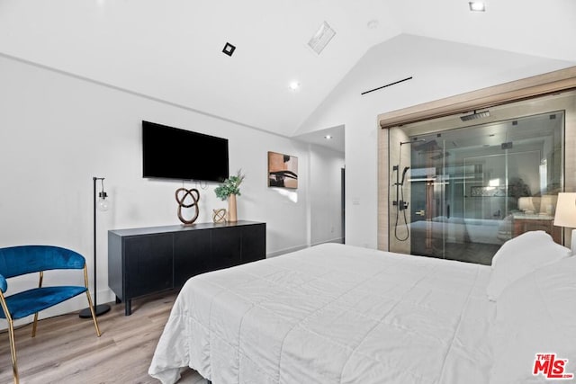 bedroom featuring lofted ceiling and hardwood / wood-style flooring