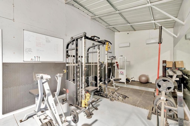 workout area featuring a wall mounted air conditioner