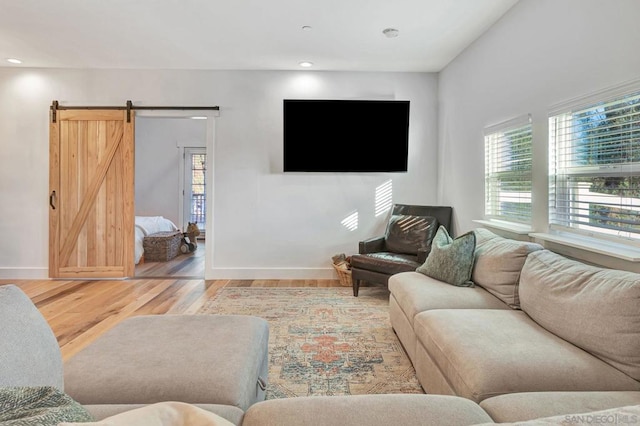 living room featuring hardwood / wood-style flooring and a barn door