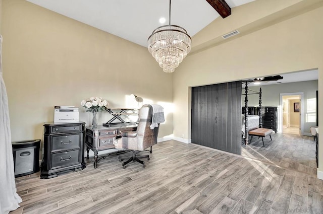 office area featuring lofted ceiling with beams and a notable chandelier