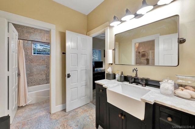 bathroom with shower / bath combo with shower curtain and vanity