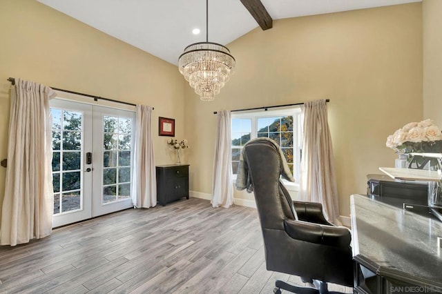 office featuring a notable chandelier, french doors, vaulted ceiling with beams, and light hardwood / wood-style floors