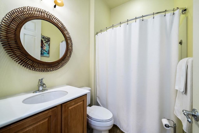 bathroom with toilet and vanity