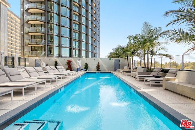 view of swimming pool featuring a patio