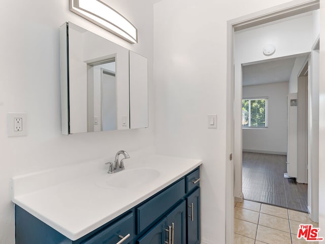 bathroom featuring vanity and tile patterned flooring