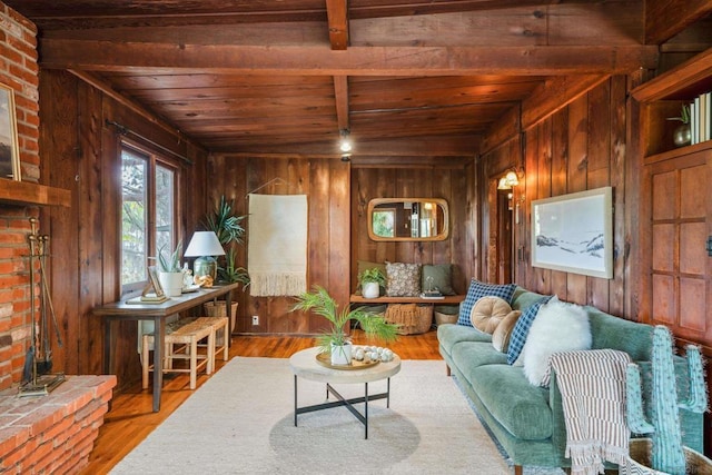 living room with wood ceiling, wood-type flooring, wooden walls, and beamed ceiling