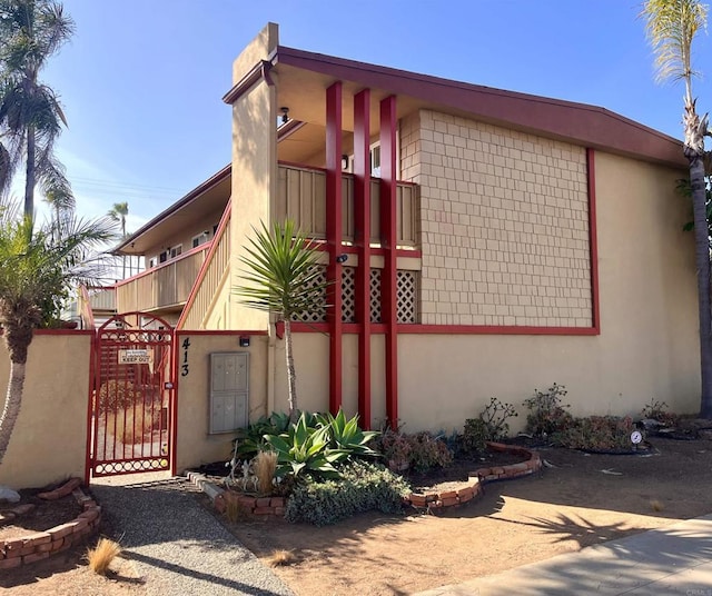 view of side of home with a balcony