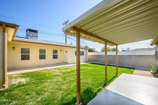 view of yard with a patio area and central AC