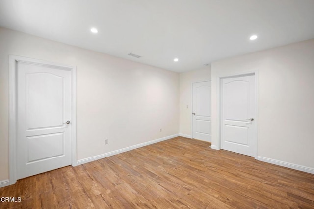 unfurnished room featuring light wood-type flooring