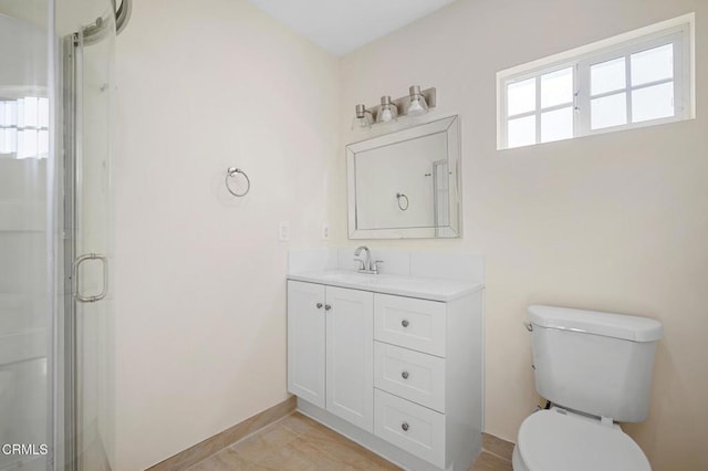 bathroom with toilet, walk in shower, tile patterned floors, and vanity