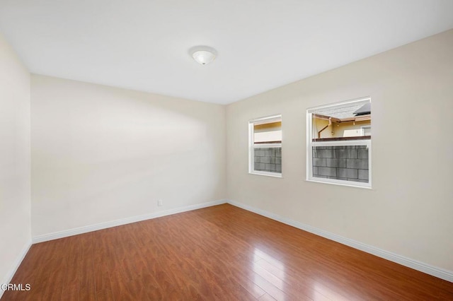 unfurnished room featuring wood-type flooring