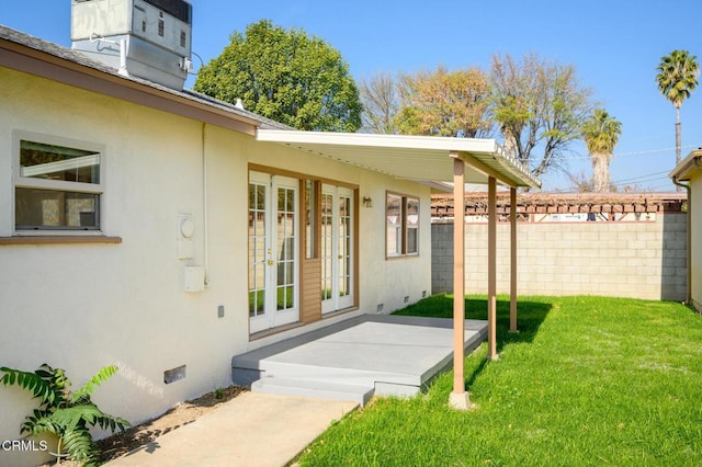 view of yard featuring french doors