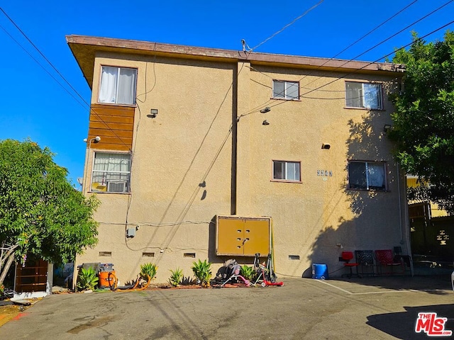 view of side of home with cooling unit